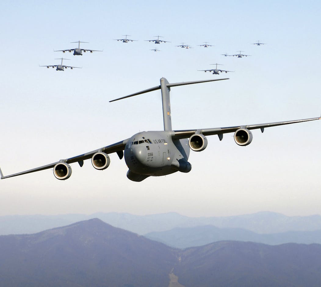 A massive military plane soaring through the sky